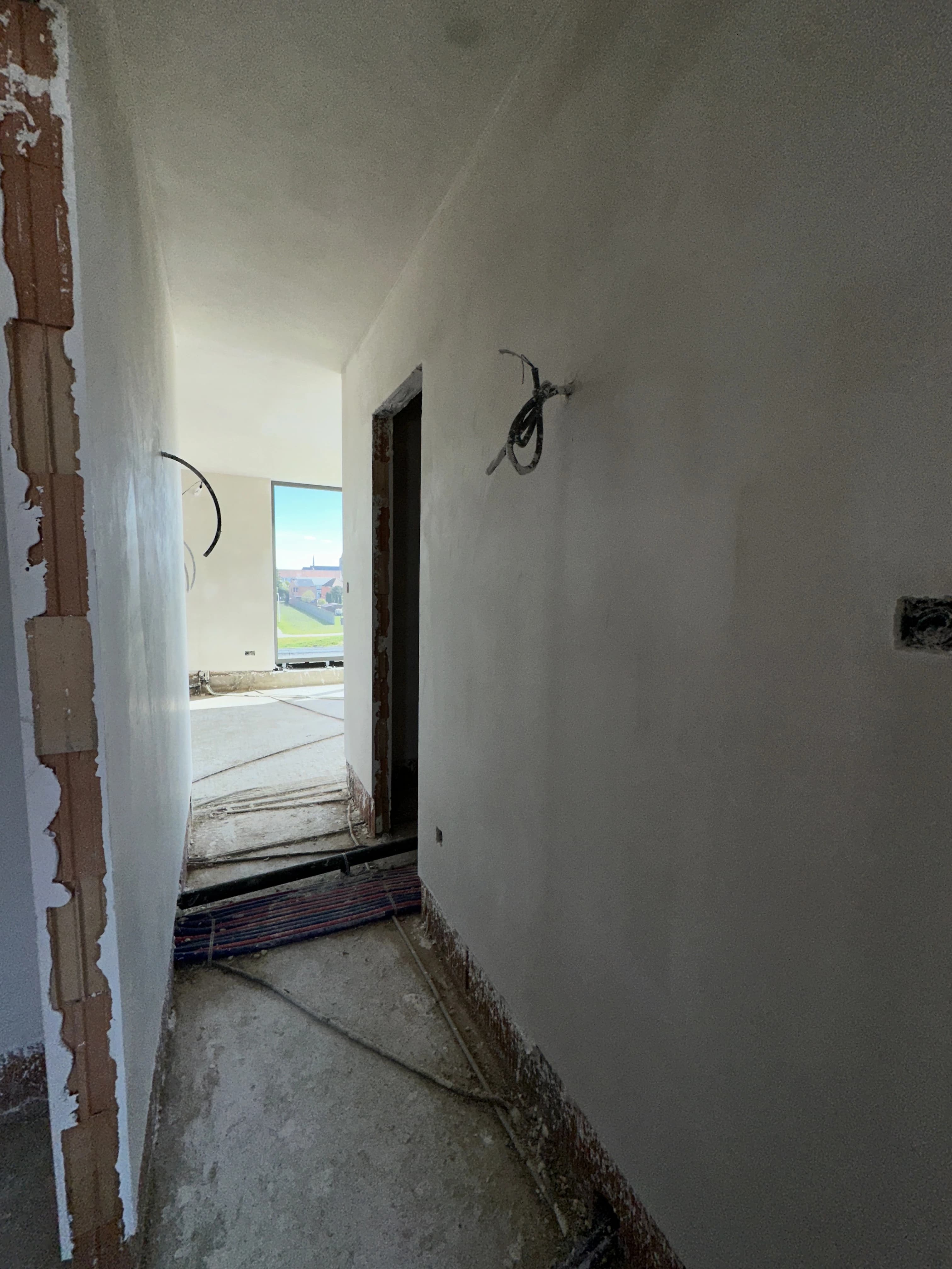 Binnenpleisterwerken Residentie Vennenpark Lommel — foto 8